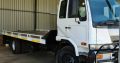 2003 Nissan UD 80 Rollback with winch Truck for sale. Selling wit