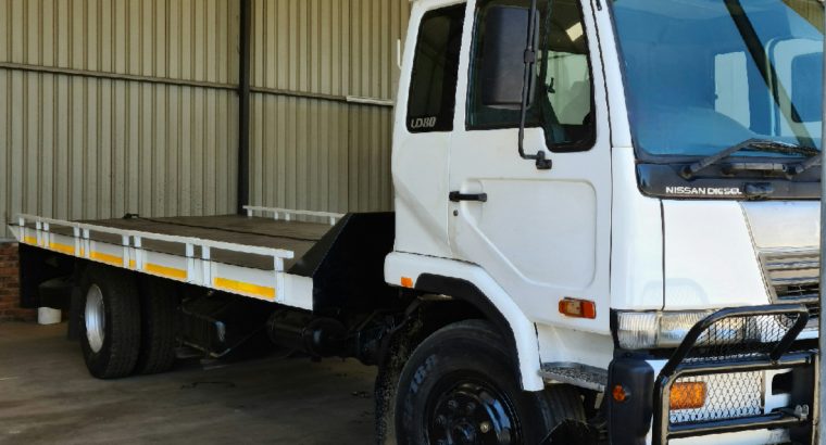 2003 Nissan UD 80 Rollback with winch Truck for sale. Selling wit